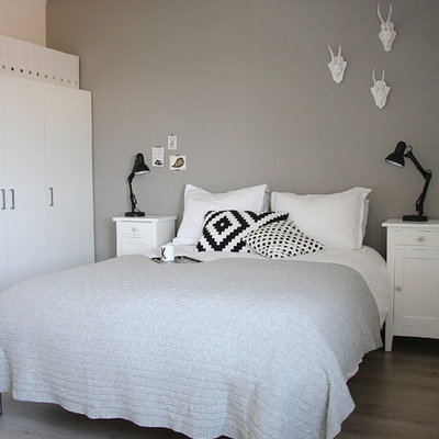 Bedroom - scandinavian light wood floor bedroom idea in Amsterdam with gray walls