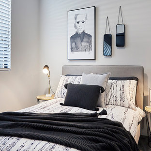 This is an example of a scandinavian bedroom in Perth with white walls, carpet and grey floor.
