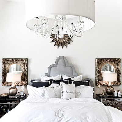 Inspiration for an eclectic master bedroom remodel in Dallas with white walls