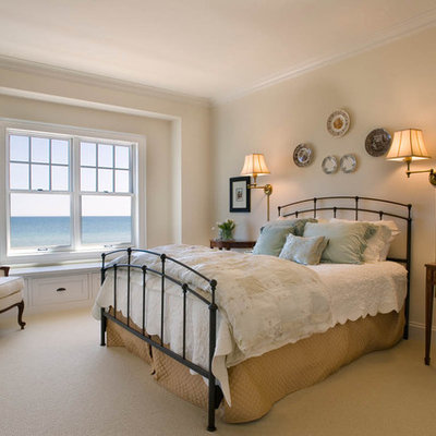Bedroom - large coastal master carpeted and beige floor bedroom idea in Milwaukee with beige walls and no fireplace