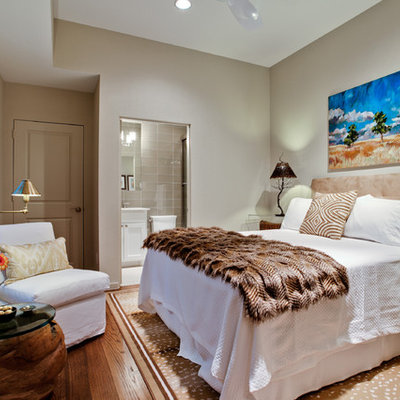 Mid-sized elegant guest medium tone wood floor bedroom photo in Dallas with no fireplace and gray walls