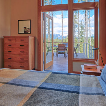 The second bedroom with exterior door leading to deck.