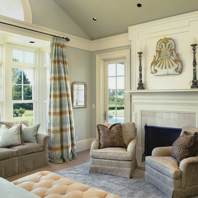 Example of a classic bedroom design in Portland with gray walls and a standard fireplace