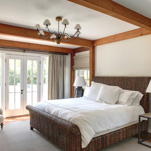 Bedroom - large traditional master medium tone wood floor and brown floor bedroom idea in Manchester with white walls and no fireplace