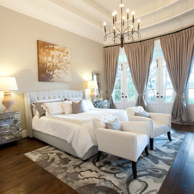 Inspiration for a timeless dark wood floor bedroom remodel in Dallas with beige walls