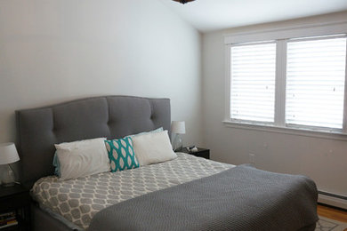 Example of a transitional bedroom design in Boston
