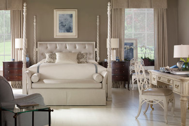 Inspiration for a large traditional master bedroom in London.