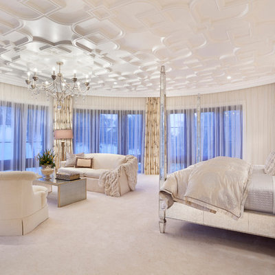 Elegant bedroom photo in Miami with beige walls
