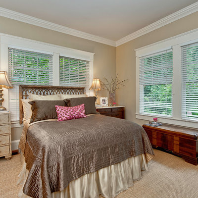 Inspiration for a timeless bedroom remodel in Charlotte with beige walls