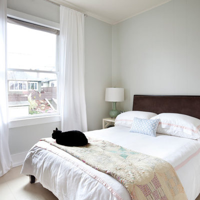 Elegant bedroom photo in Other with gray walls