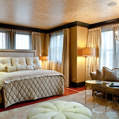 Inspiration for a timeless medium tone wood floor bedroom remodel in Chicago with beige walls