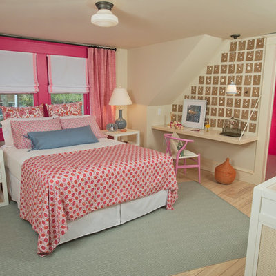 Inspiration for a timeless light wood floor bedroom remodel in DC Metro with pink walls