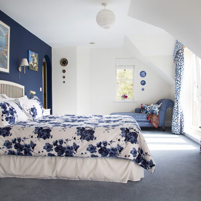 Elegant master carpeted and blue floor bedroom photo in Kent with multicolored walls