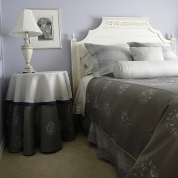 Traditional custom bedding and bedside table dressing