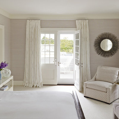 Beach style master bedroom photo in New York with gray walls and no fireplace