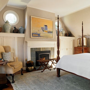 Porthole windows add interest to this inviting traditional guest room