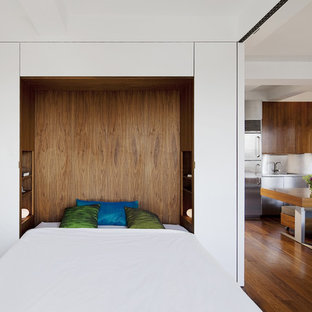 Inspiration for a modern bedroom remodel in New York with white walls