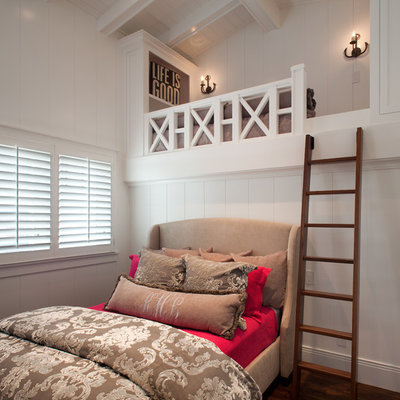 Beach style bedroom photo in San Diego with white walls