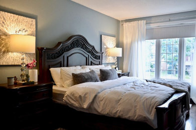 Example of a transitional bedroom design in Toronto