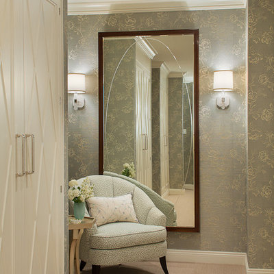 Example of a large transitional master carpeted bedroom design in New York with gray walls and no fireplace