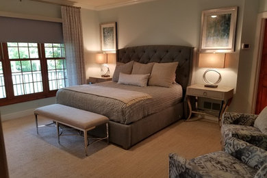 This is an example of a medium sized classic master bedroom in Other with blue walls, carpet, no fireplace and grey floors.