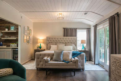 Large classic master bedroom in Kansas City with beige walls, dark hardwood flooring, no fireplace and brown floors.