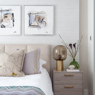 Inspiration for a contemporary bedroom in London with beige walls, dark hardwood flooring and brown floors.