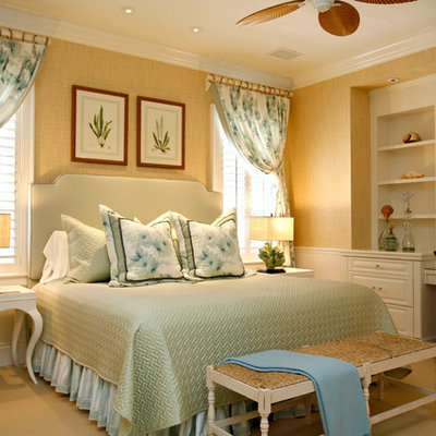 Inspiration for a tropical carpeted bedroom remodel in Other with beige walls