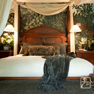 Bedroom - mid-sized tropical master medium tone wood floor bedroom idea in Santa Barbara with green walls