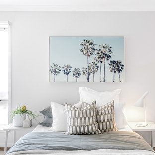 Contemporary bedroom in Melbourne with beige walls, carpet and beige floor.