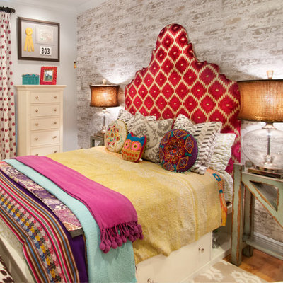 Example of an eclectic bedroom design in Orlando with gray walls