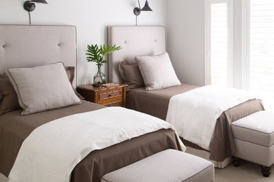 Twin Bedroom with dark brown bed sheets, white linen duvet cover.