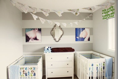 Inspiration for a small contemporary carpeted nursery remodel in Calgary with gray walls
