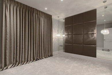 Design ideas for a medium sized contemporary master bedroom in London with brown walls.