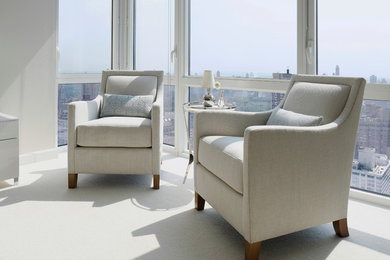 Photo of a medium sized contemporary master bedroom in New York with white walls and carpet.