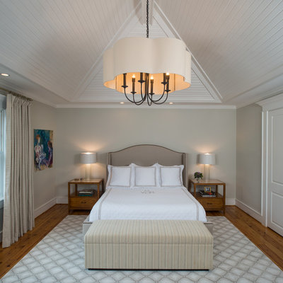 Bedroom - large traditional master light wood floor bedroom idea in Houston with gray walls and no fireplace