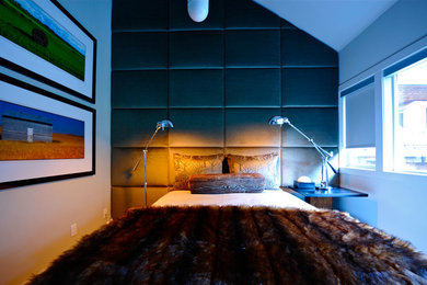 This is an example of a small modern guest bedroom in Dallas with grey walls and no fireplace.