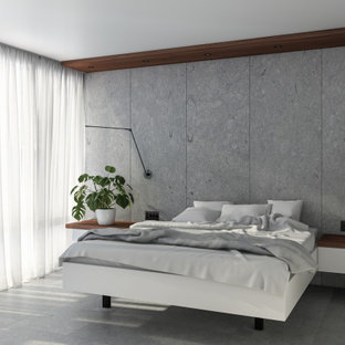 Großes Asiatisches Hauptschlafzimmer ohne Kamin mit grauer Wandfarbe, grauem Boden und Kalkstein