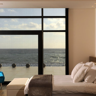 Trendy bedroom photo in Other with beige walls