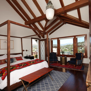 Inspiration for a mid-sized craftsman master dark wood floor and brown floor bedroom remodel in Los Angeles with white walls and no fireplace
