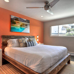 Modelo de dormitorio tropical con parades naranjas
