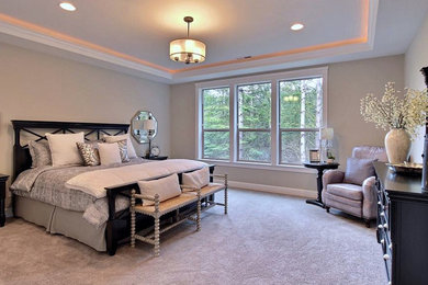 Mid-sized transitional master carpeted and beige floor bedroom photo in Portland with beige walls and no fireplace