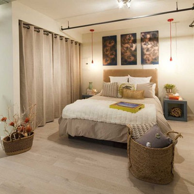 Bedroom - eclectic light wood floor bedroom idea in Los Angeles with beige walls