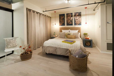 Bedroom - eclectic light wood floor bedroom idea in Los Angeles with beige walls