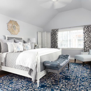 Elegant master dark wood floor bedroom photo in Other with gray walls and no fireplace