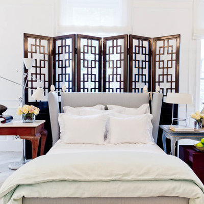 Example of an eclectic carpeted bedroom design in New York with white walls