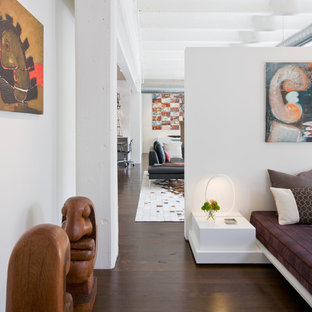 Example of a trendy dark wood floor bedroom design in DC Metro with white walls