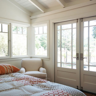 Bedroom - small cottage guest medium tone wood floor bedroom idea in San Francisco with white walls