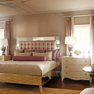 Inspiration for a large timeless master medium tone wood floor bedroom remodel in Atlanta with black walls