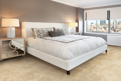 Example of a large ceramic tile bedroom design in Sacramento with brown walls